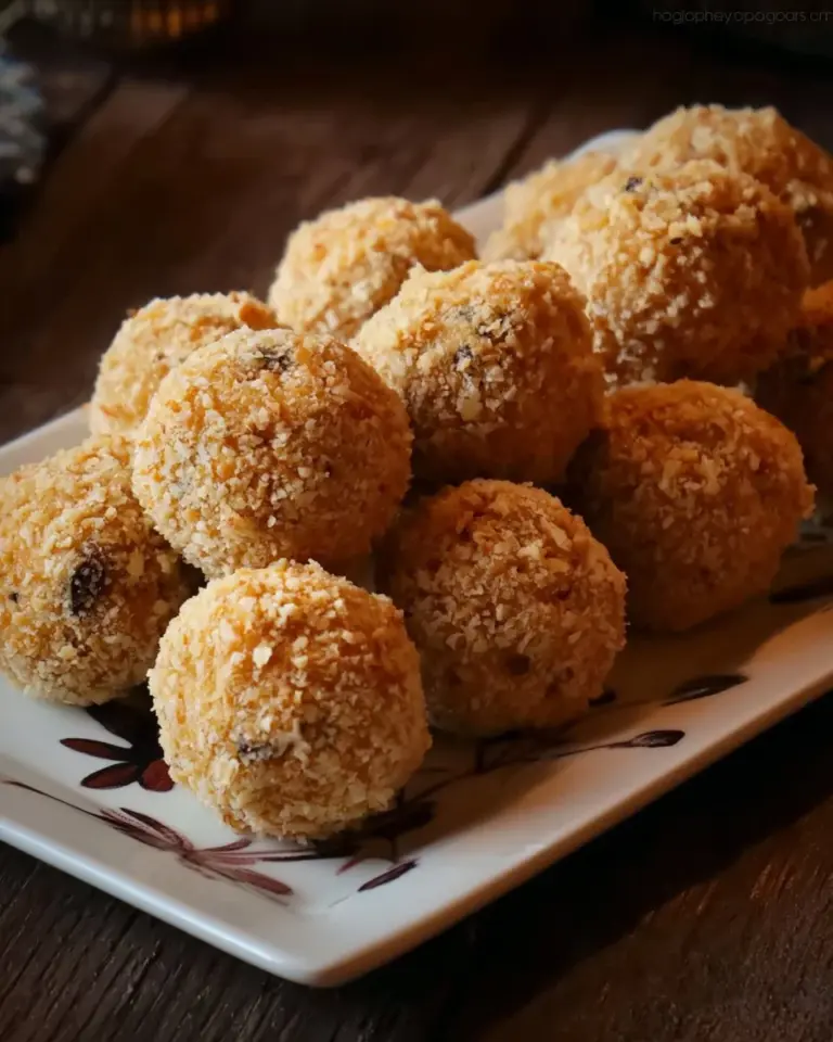 No-bake chocolate coconut balls on a plate, looking delicious and ready to serve.