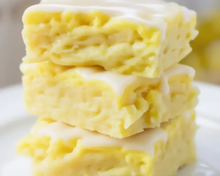 Delicious homemade lemon brownies topped with a sweet lemon glaze and fresh zest.