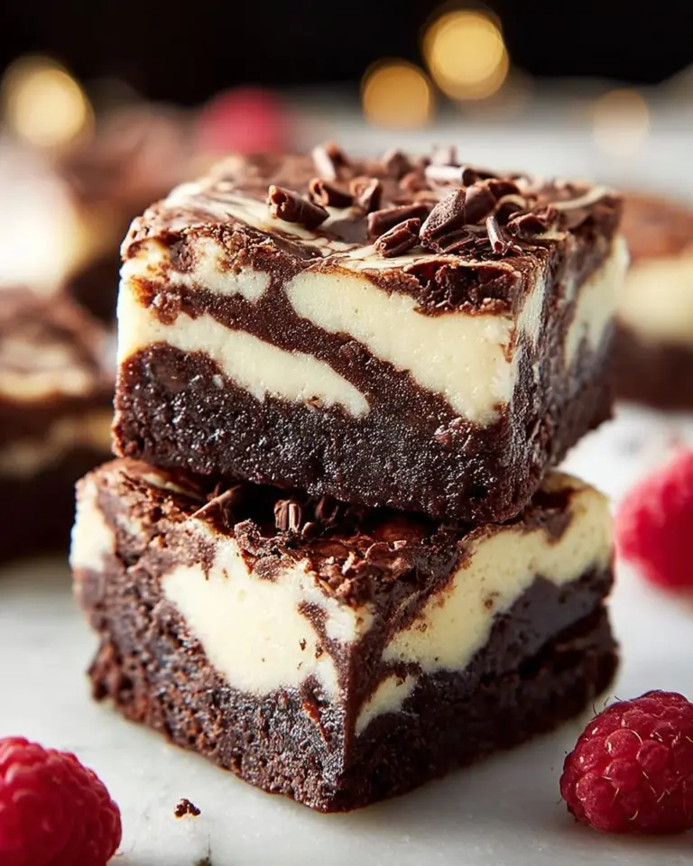 Delicious cheesecake brownies with a rich and creamy topping over a fudgy base.