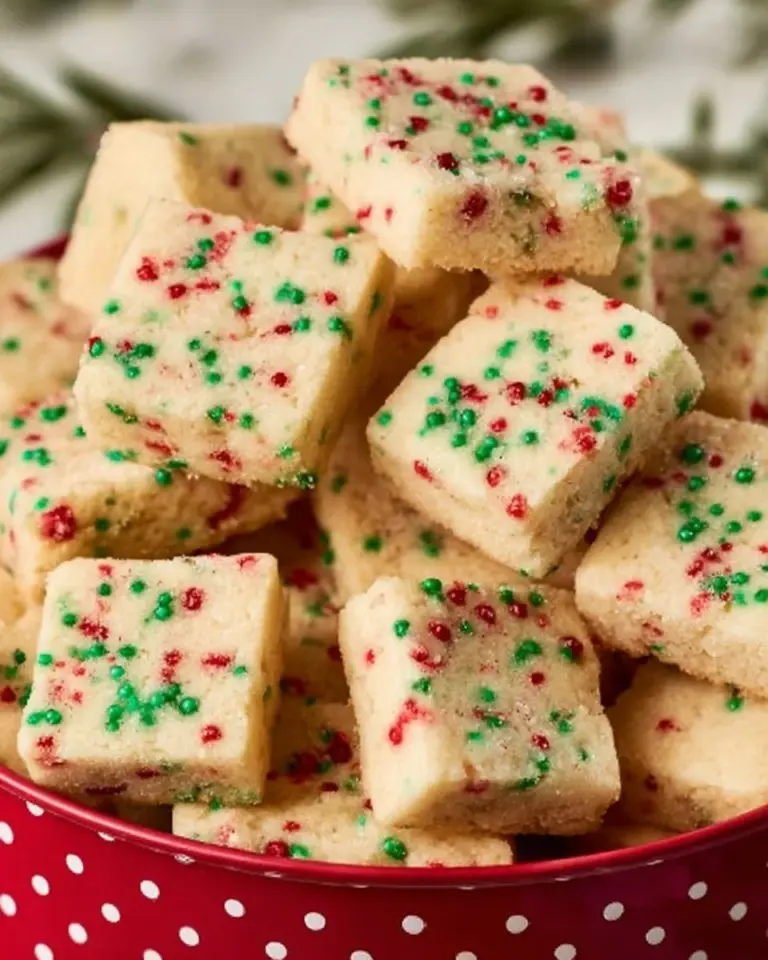 Delicious Christmas shortbread cookie bites decorated with festive toppings