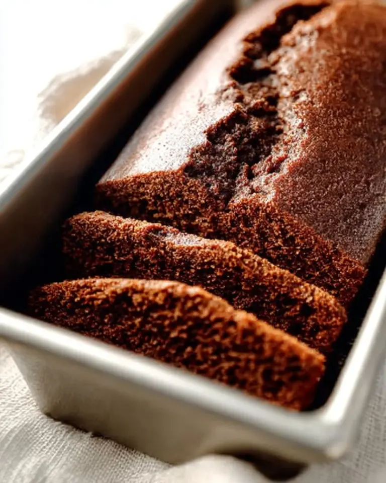 Slice of traditional French Gingerbread on a wooden board