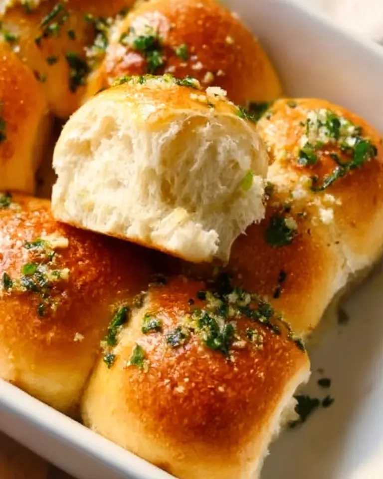 Freshly baked garlic bread rolls with a golden crust and aromatic garlic flavor.