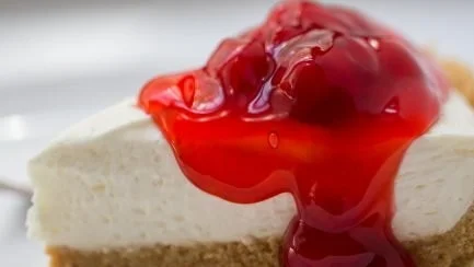 Delicious no-bake cheesecake topped with fresh berries and whipped cream