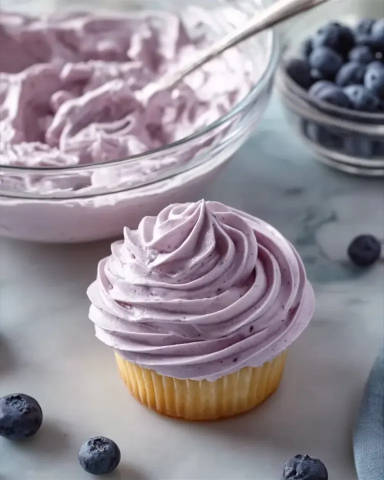 Blueberry Cream Cheese Frosting spread on a cake