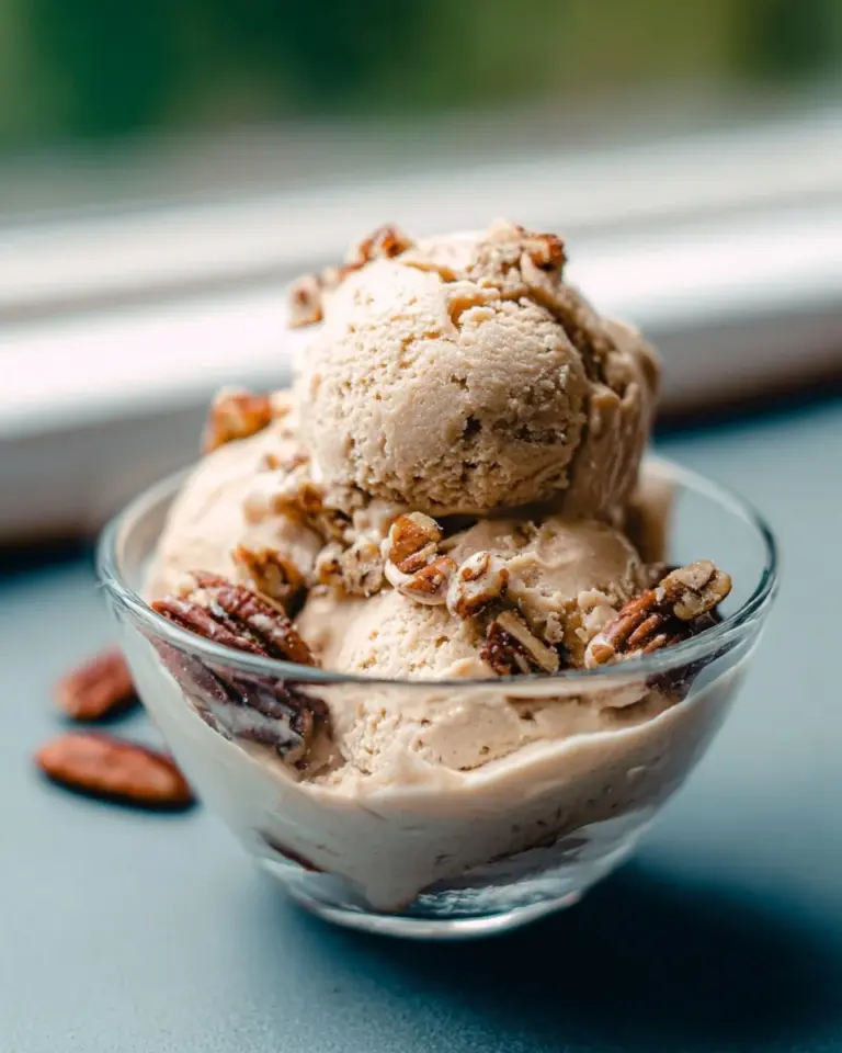 Vegan Maple Butter Pecan Ice Cream with nuts and maple syrup drizzle