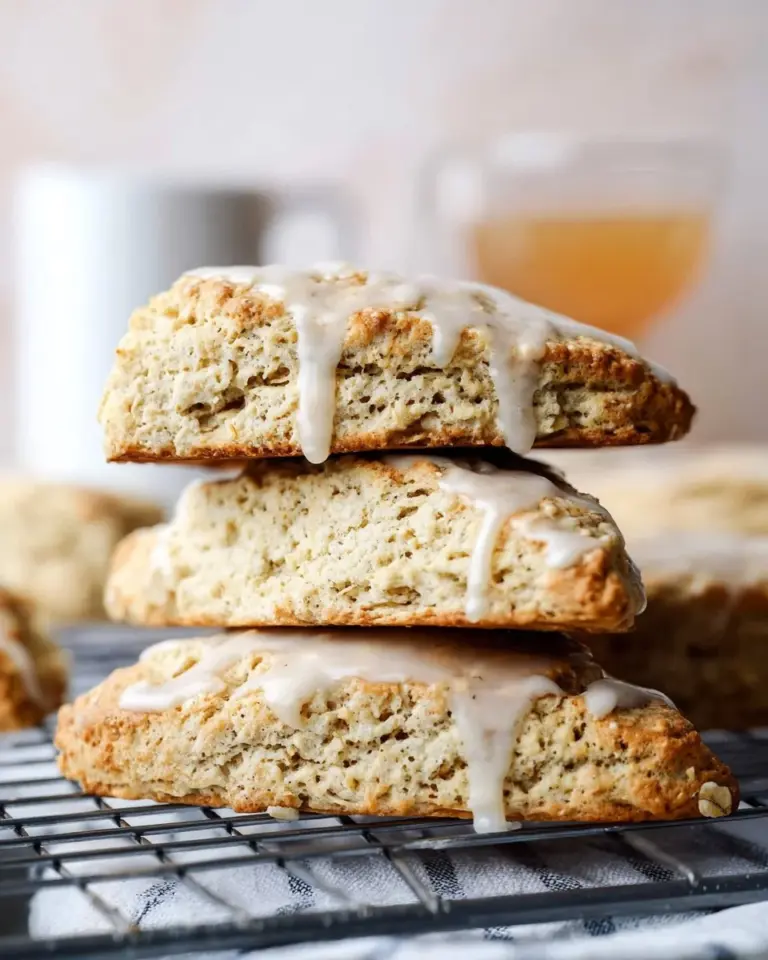 Delicious Earl Grey scones with lemon glaze on a rustic plate