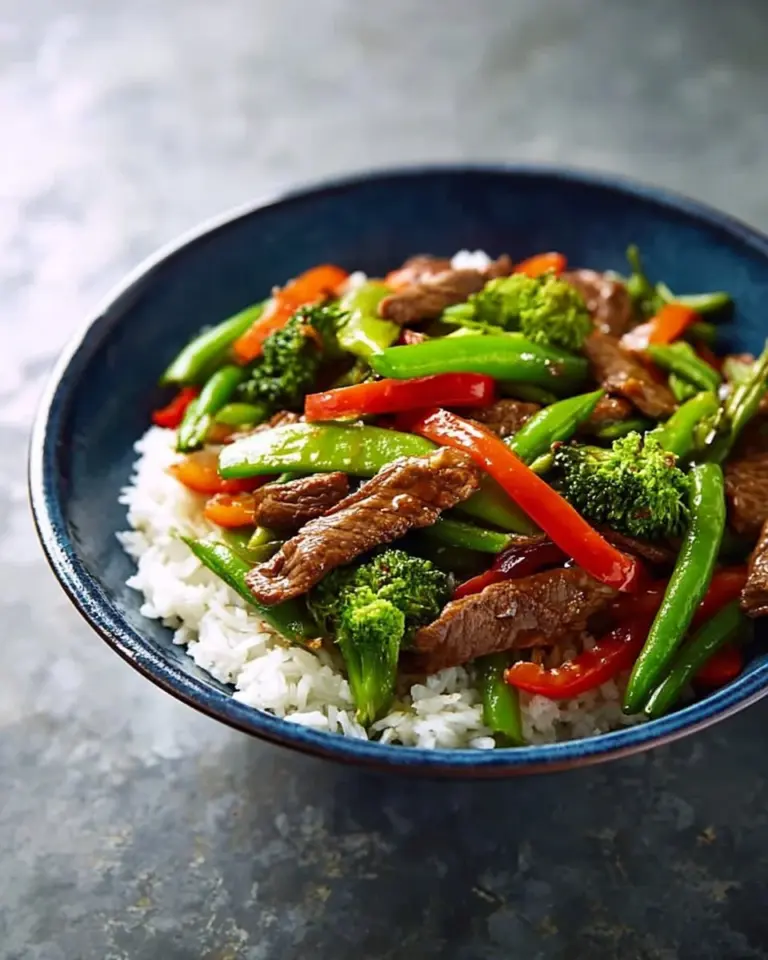 Delicious quick beef stir-fry served with colorful vegetables