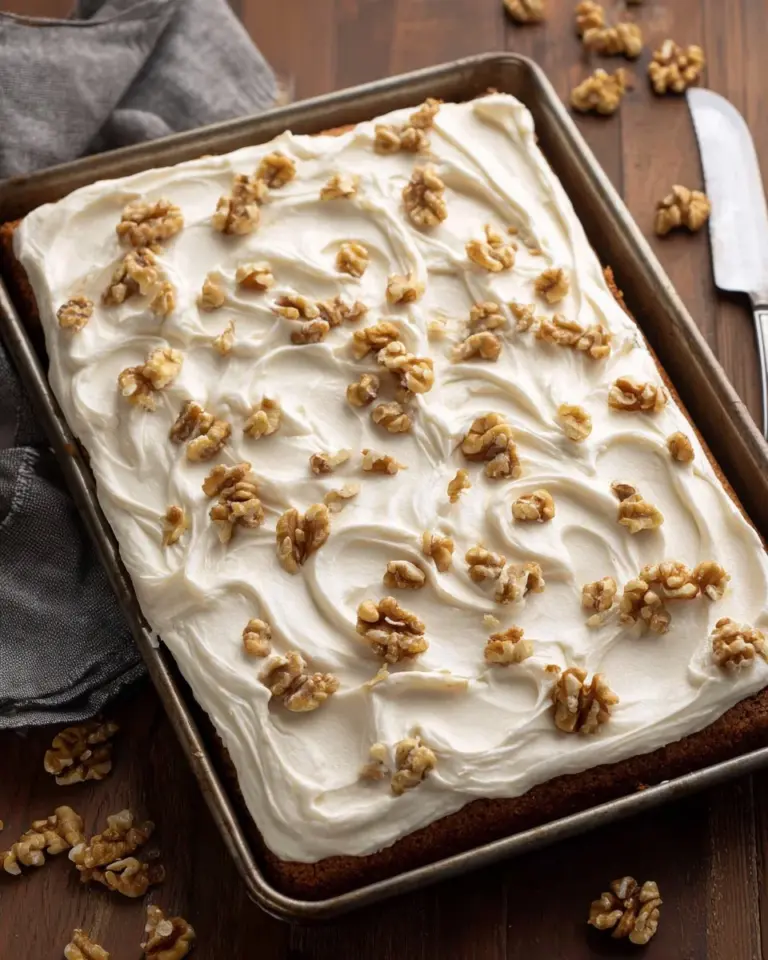 Delicious sheet pan carrot cake bars topped with cream cheese frosting.