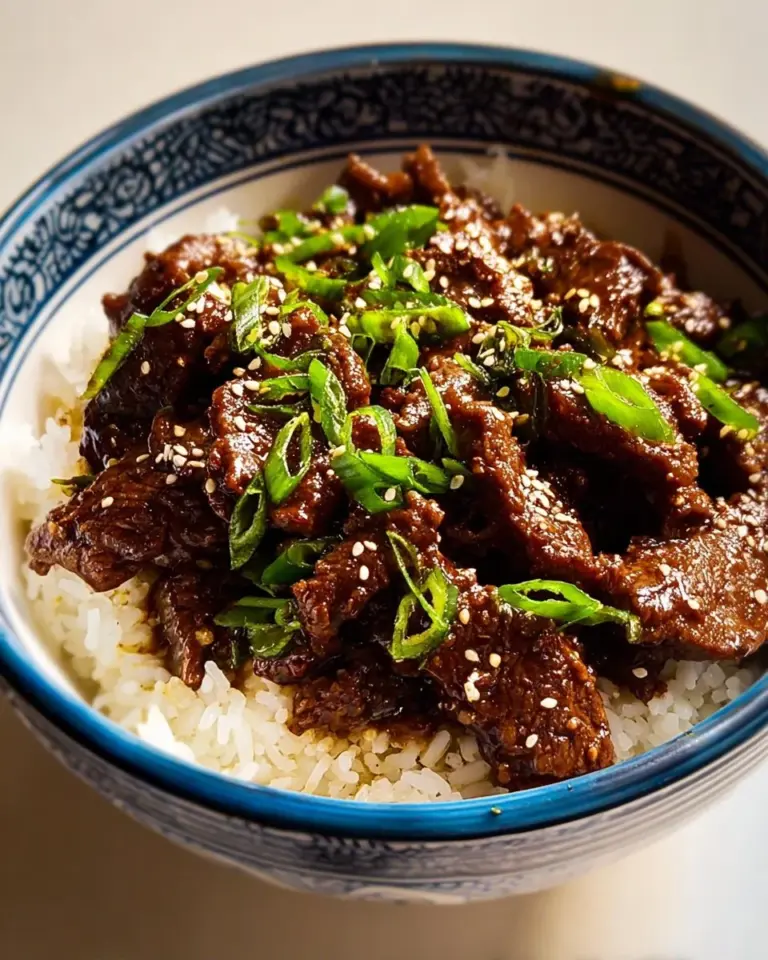 Slow Cooker Mongolian Beef simmering with vegetables and sauce
