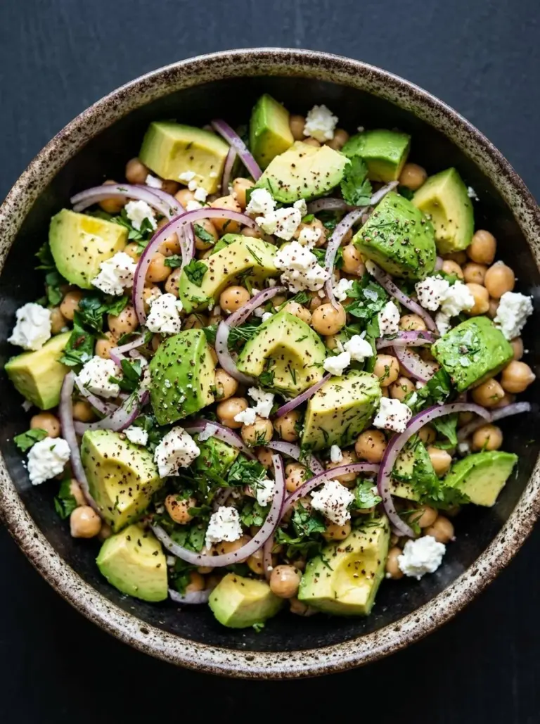 Chickpea Feta Avocado Salad with fresh ingredients in a bowl